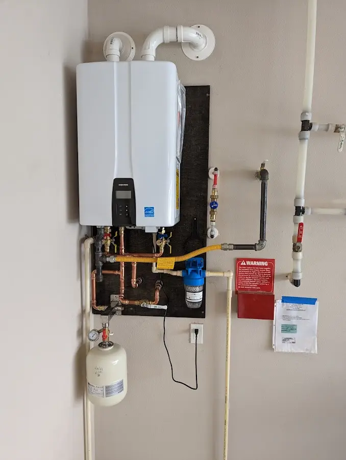 Professional plumber installing copper piping in a Ridgecrest home